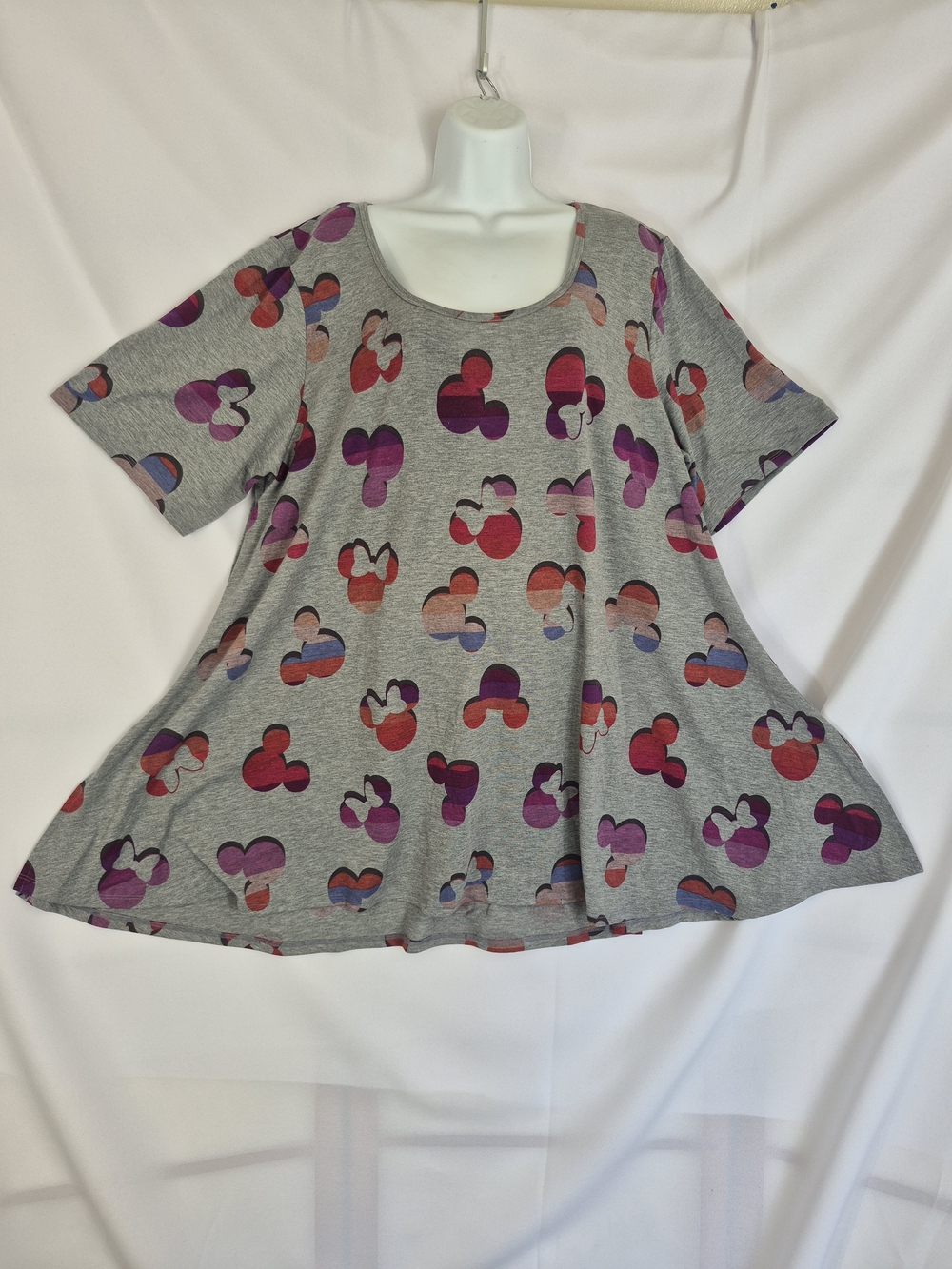 LuLaRoe Disney short-sleeve top featuring an all-over colorful Mickey and Minni